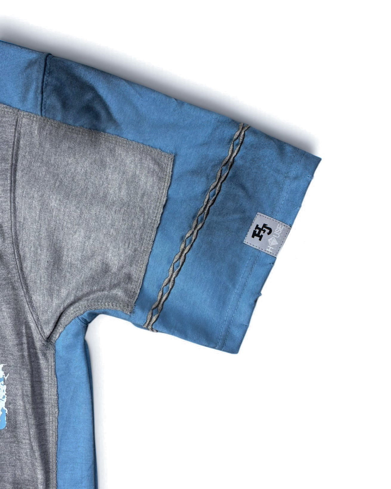 House of Juelz blue double layer shirt sleeve stitching and label detail
